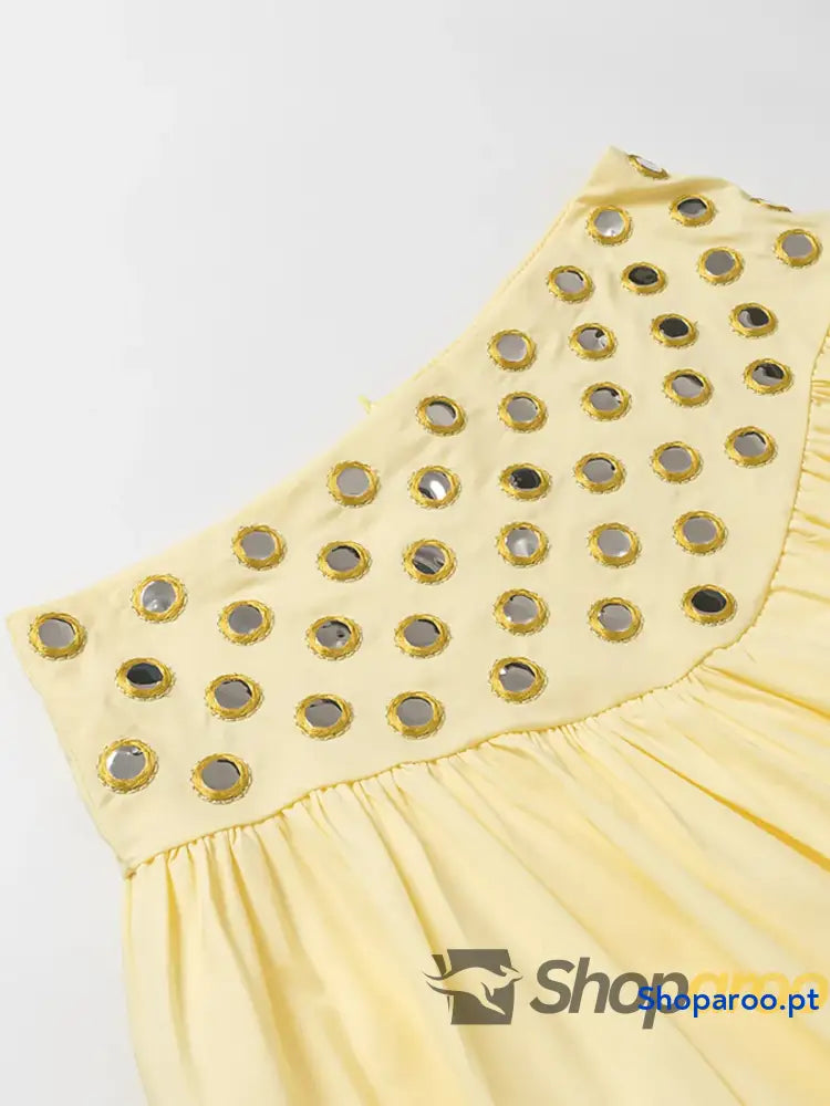 Conjunto de camisola com ilhós e saia bolha